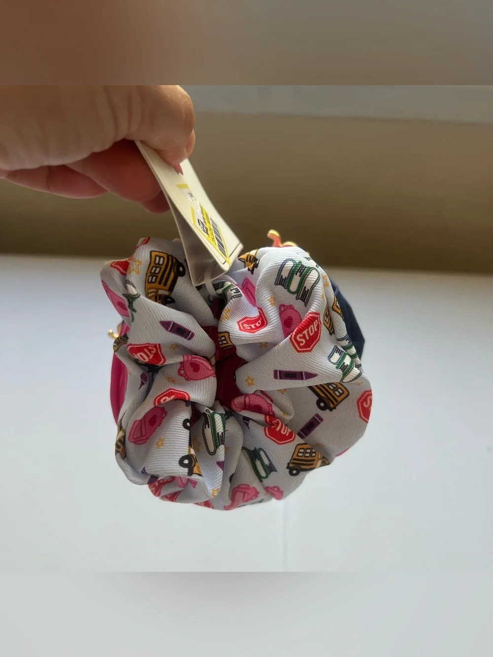 This is a 3-pack of themed hair scrunchies designed with school-related motifs.